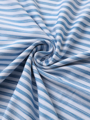 Close-up of sky blue white unique watercolour stripe polo fabric showing soft, blended stripes and smooth texture.