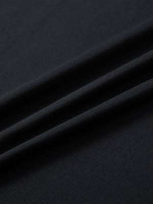 Close-up of black everyday classic solid polo fabric texture.