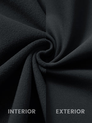 Close-up of the inner and outer fabric of kids soft lightweight fleece lined jacket in black.