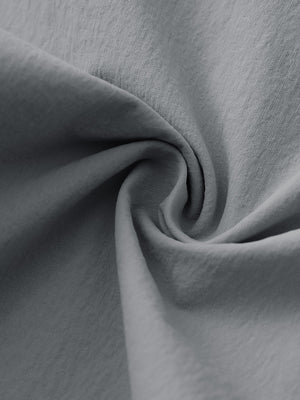 Fabric close-up of Performance water resistant pants with durable texture and neutral grey detail