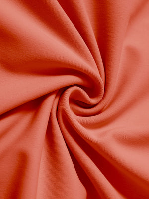 Fabric close-up of dry fit stretchy sweatshirts hoodies, soft knit texture with breathable feel in orange