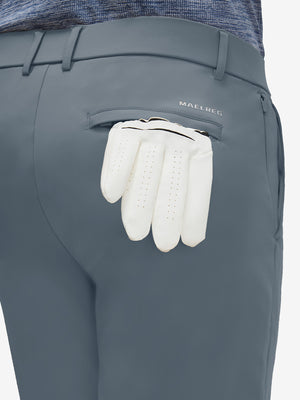 Detail view of back pocket on grey blue flat front golf joggers pants with belt loops