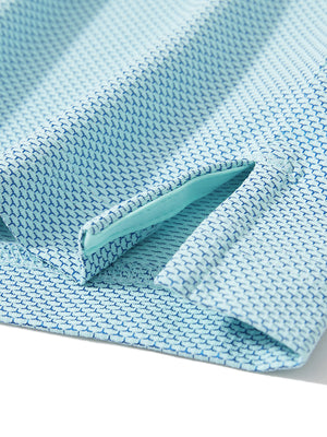 Detail of the side vent hem on the aqua feather weight jacquard polo shirts, showing the split design feature