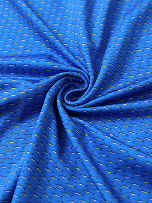 Close-up of blue swordfish performance jersey print polo fabric texture.