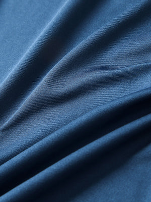 Close-up of blue everyday classic solid polo fabric texture.