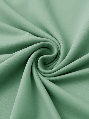 Close-up of fabric on stylish chest print snap polo, showing texture and finish in beryl green.