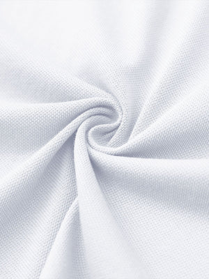Fabric close-up of white cotton blend pique plain shirt, breathable pique fabric texture.
