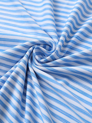 Close-up of powder blue white unique watercolour stripe polo fabric showing soft, blended stripes and smooth texture.