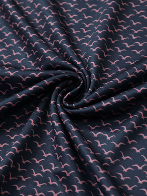 Fabric close-up of Everyday performance print polo with lightweight texture in navy pink seagull