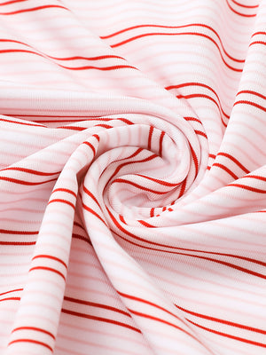 Fabric close-up of Performance stripe golf shirts with breathable weave in pink red stripe