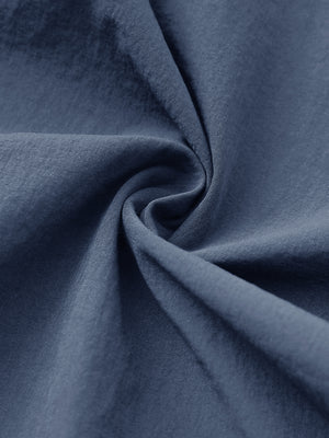 Fabric close-up of Performance water resistant pants with durable texture and dusty blue detail