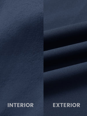 Close-up of inside and outside fabric of water-resistant fleece golf vest in navy, highlighting material texture and durability for optimal performance.