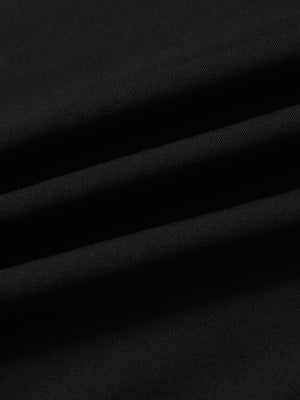 Fabric close-up of print collar quarter zip golf vest, smooth material with subtle texture in black