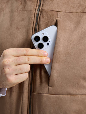 Close-up view of khaki classic micro suede leather puffer vest exterior center pocket detail