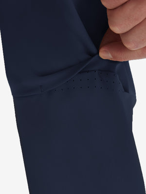 Detail view of design on navy flat front golf joggers pants with belt loops