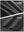 Close-up texture of dark grey women's moisture-wicking athletic tennis skirts fabric showing detailed outer and inner lining material.