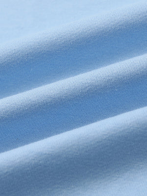 Close-up of fabric on 2 in 1 running sports shorts with liner, showing texture and finish in light blue