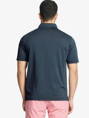 Rear half-body view showing fit and jacquard pattern of Ventilated Heather Jacquard Polo – JUNGLE GREEN HEATHER