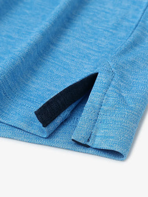 Close-up of hem opening on Modern Fit Melange Polo in BLUE HEATHER, highlighting quality stitching.