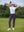 Woman wearing Women's Ultra-stretch Quick Dry Sweatpants with Ankle Zips in dark purple, holding golf club on course