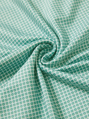 Close-up fabric detail of lightweight print long sleeve polo, breathable texture and soft feel in green plant