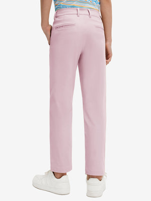 Back lower body view of model wearing the pink youth water resistant cotton blend golf pants, highlighting the rear design