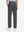 Back lower body view of model wearing the dark grey youth water resistant cotton blend golf pants, highlighting the rear design