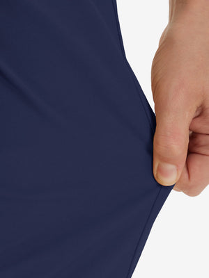 Action shot demonstrating the stretch of the dark blue youth water resistant cotton blend golf pants for active movement