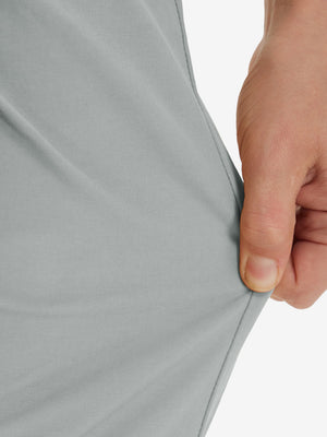 Action shot demonstrating the stretch of the rose dust youth water resistant cotton blend golf pants for active movement