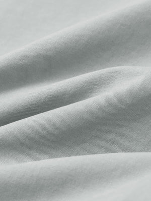 Macro view of the rose dust youth water resistant cotton blend golf pants fabric, showcasing the water repellent surface