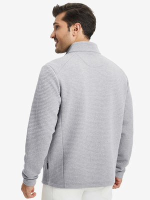 Back upper body view of model wearing textured insulated winter jacket, smooth finish, light grey heather.