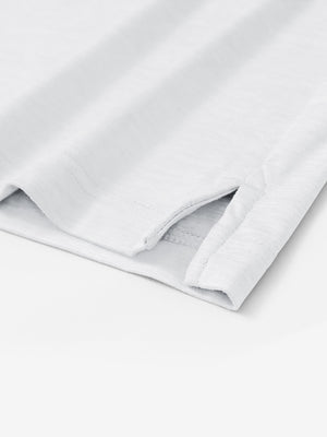 Hem detail of Skin-friendly long sleeve melange polo with neat stitching in white