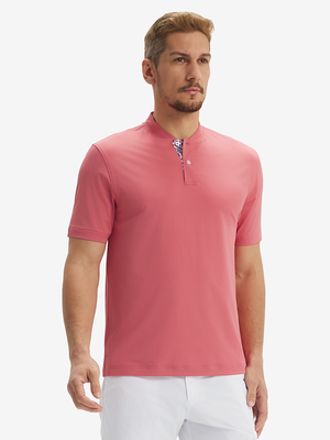 Front half-body view of model wearing brick red moisture-wicking short sleeve henley shirt