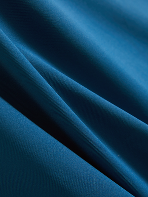 Close-up of blue Moisture-Wicking Short Sleeve Henley Shirt fabric texture.