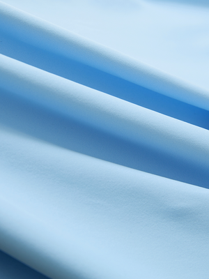 Close-up of light blue Moisture-Wicking Short Sleeve Henley Shirt fabric texture.