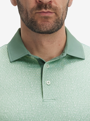 Close-up: nose to chest in green abstract lines lightweight stretch upgraded print golf polo shirts