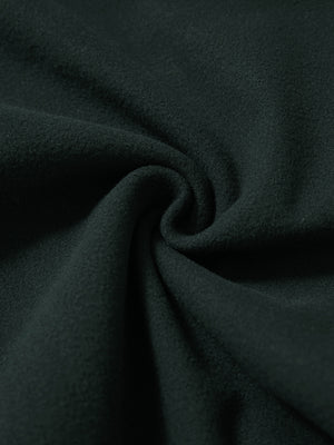 Fabric close-up of dark grey water resistant comfy fleece golf joggers, soft fleece texture with water-resistant finish.