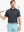 Full body front view of model wearing DARK GREY/BLACK Your Favorite Jacquard Polo, holding a golf club